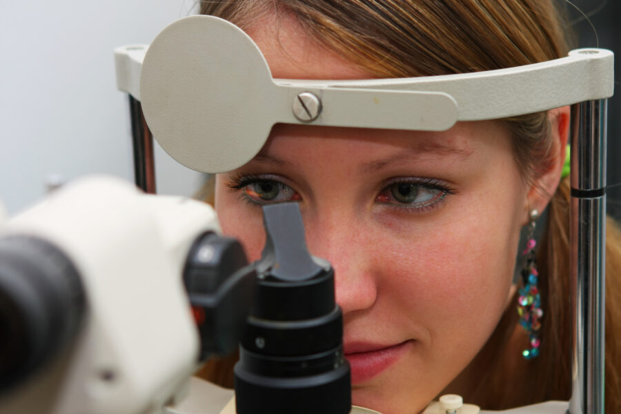 young girl at the optometrist checking her vision